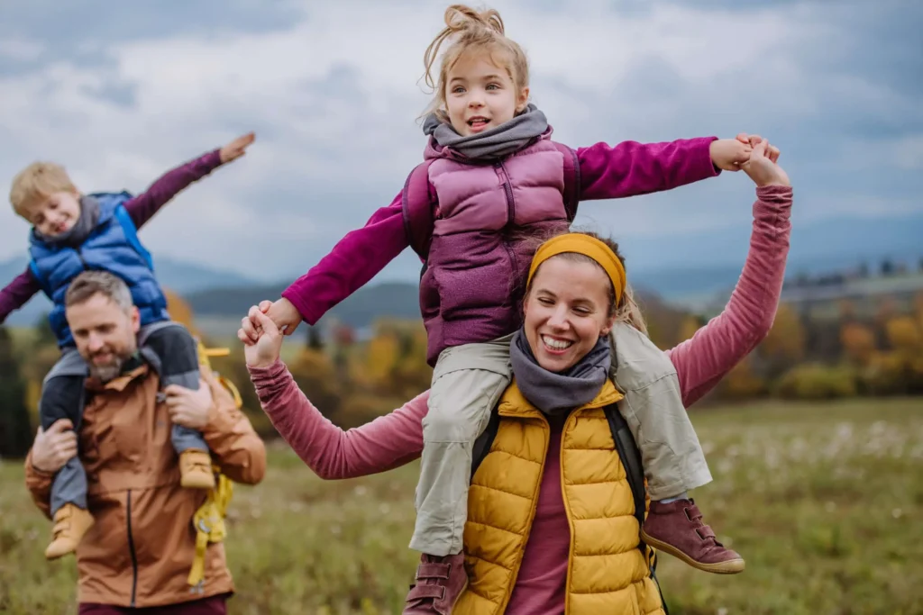 Picture of parents with kids on a hike